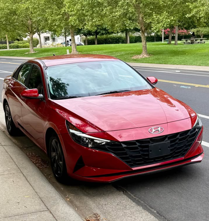 2023 Hyundai Elantra, red sedan, front three-quarter view