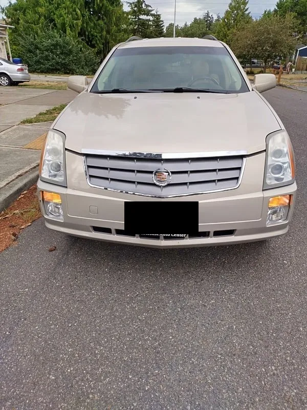 2008 Cadillac SRX, gold SUV, front view
